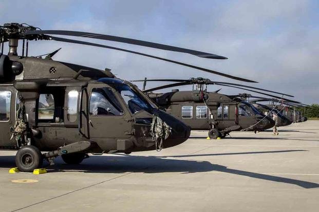 Flight line view of U.S. Army UH-60L Black Hawk helicopters. (Mark C. Olsen) Flight line view of U.S. Army UH-60L Black Hawk helicopters.